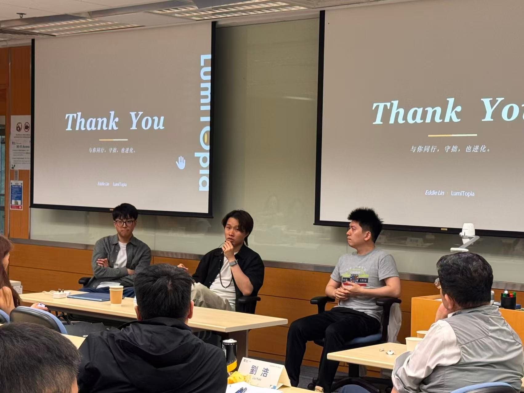 Speakers taking questions at an HKU EMBA class at Cyberport