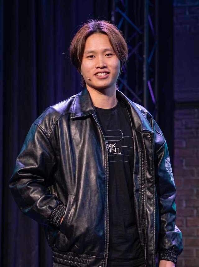 Ryan Chi, marketing and creative instructor, speaking on stage