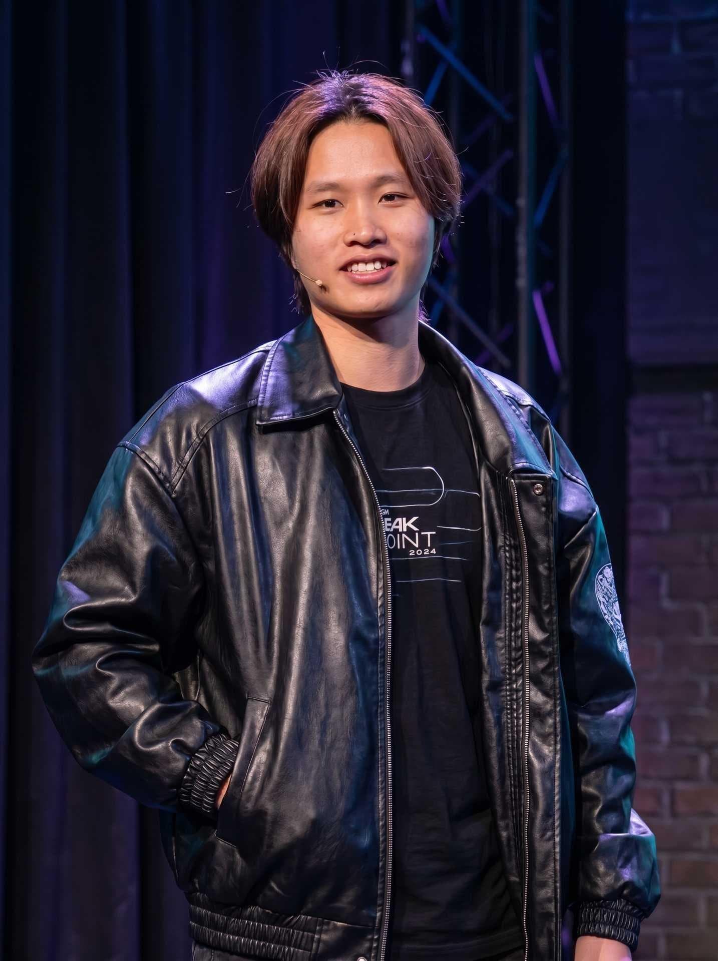 Ryan Chi, Marketing and Creative Instructor, speaking on stage